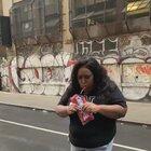 Woman's personal trainer doesn't like the Twizzlers in her hand