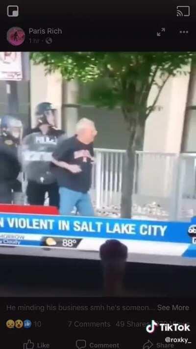 Shoving an old man with a cane.