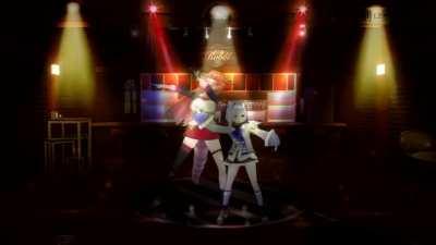 A couple of girls dancing while Roberu watches from afar wondering when they will order drinks because the bar closes in 5 minutes: