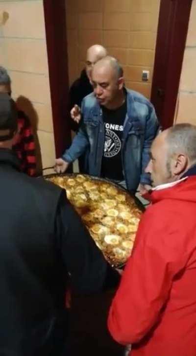 Insisting on fitting a large tray through a narrow door