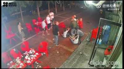 Group of men attack a woman who resists one of their members' sexual harassment in Tangshan, China. June 2022