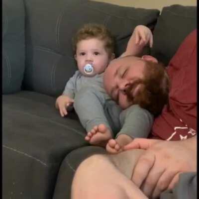 The cuddle challenge with my 19 month old and dada. The love of father and son.