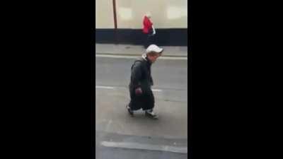 Midget kicking himself in the head.