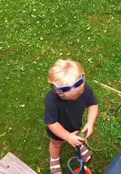 Little guy does spot on imitation of a weed whacker