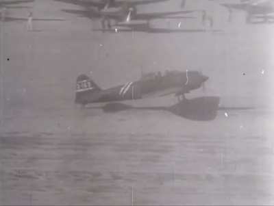 Mitsubishi A6M3 Model 22 Zeros of the 251st Kōkūtai taking off from an airfield in the southern pacific, October 1943.