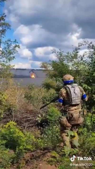 Ukrainian soldier records the moment a Russian tank is struck by a Ukrainian tank