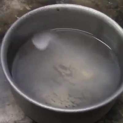 Spoon of liquid nitrogen in a bowl of gasoline forming a pentagram [GIF by pcyiss]