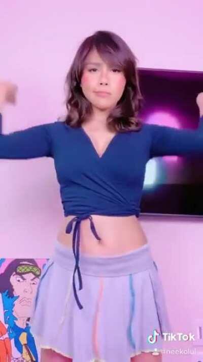 Skirt and tits in a tank top