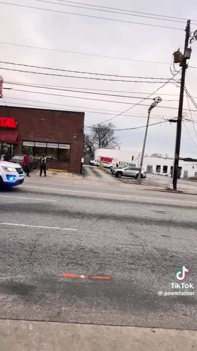 Group calmly watches and films police shootout 