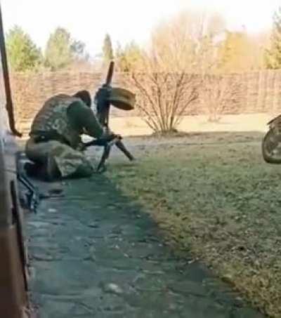 Georgian volunteers shoot a captured Russian AGS-30 automatic grenade launcher, Eastern Ukraine