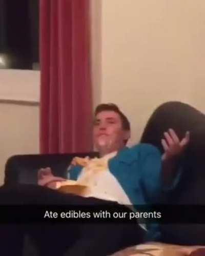 Father and son enjoy a snack together.