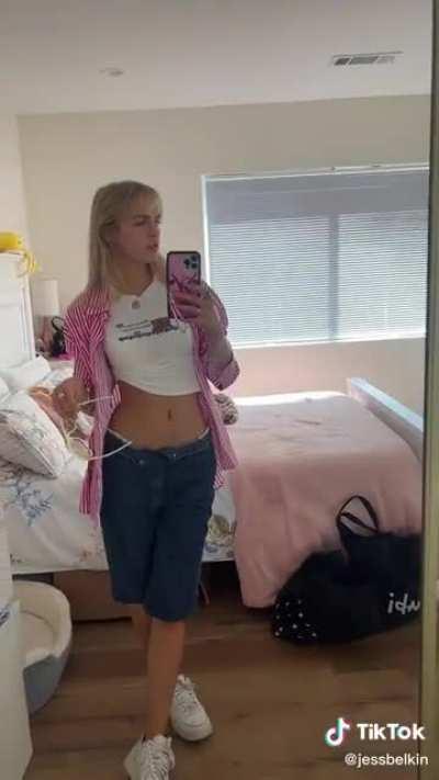 uplifted t-shirt and open pants