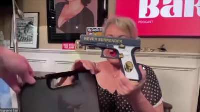 Roseanne Barr showing off her Trump Glock and very safe gun handling skills