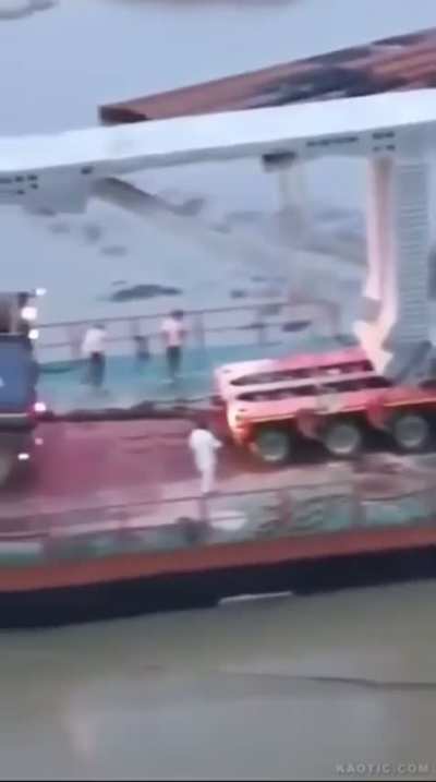 Part of prefab bridge falls over