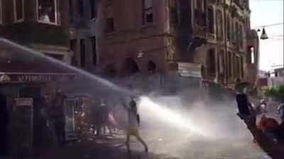 WCGW standing in front of water cannon