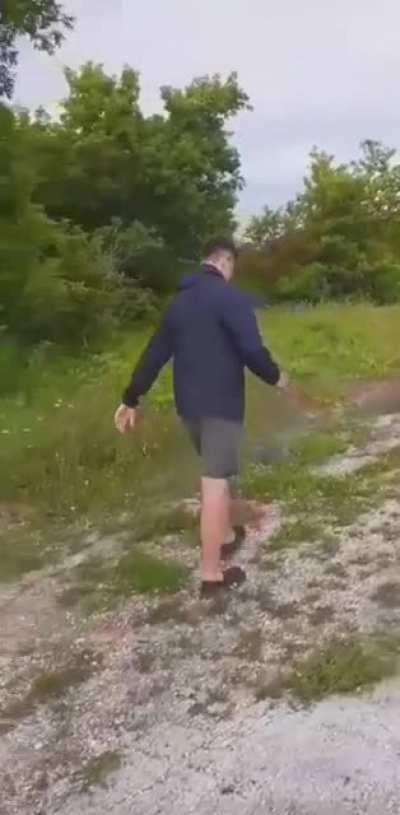 Breaking a spray paint can with a rock