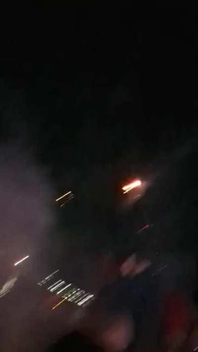 Stupid teenager throws firework into crowd and landed next to my girlfriend and I.