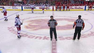 Adam Fox is booed as he dekes through the Flames defence and scores. They play is reviewed for offside, and is called back. Crowd goes wild, then breaks into 