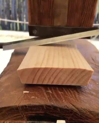 Sharp knife peeling wood