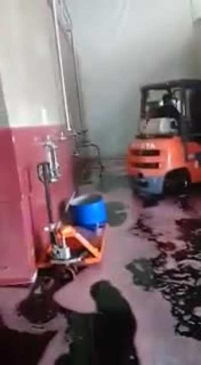 Because a worker's mistake, the wine ends up on the floor of the winery. Occurred in Mendoza, Argentina