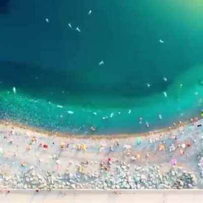 Humans, looking like bacteria from this POV. Tells us a lot about our size in comparison to everything else.