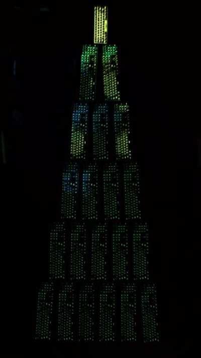 Built a giant RGB keyboard Christmas tree and synced them all. 60% keyboard as the star.