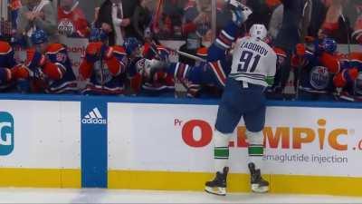 Zadorov hits Kane into his own bench. Both teams get a penalty.