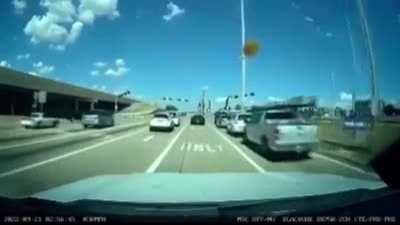 Truck falls off overpass and erupts in flames