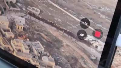 New drone footage released by advancing Hay'at Tahrir al-Sham militants shows more Assad forces (unclear if Syrian army, Wagner, or Hezbollah fighters) fleeing from their positions near Aleppo, Syria. 