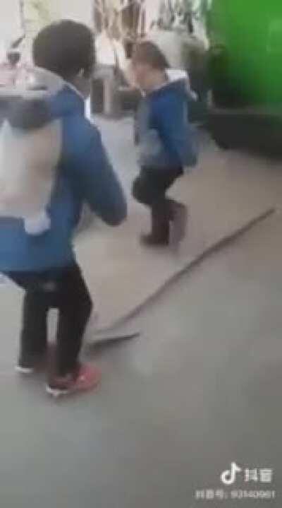 Two boys, one shovel