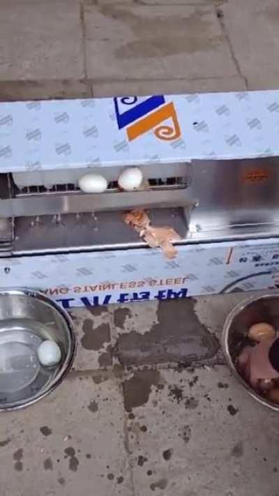 A boiled egg skin-peeling machine at work