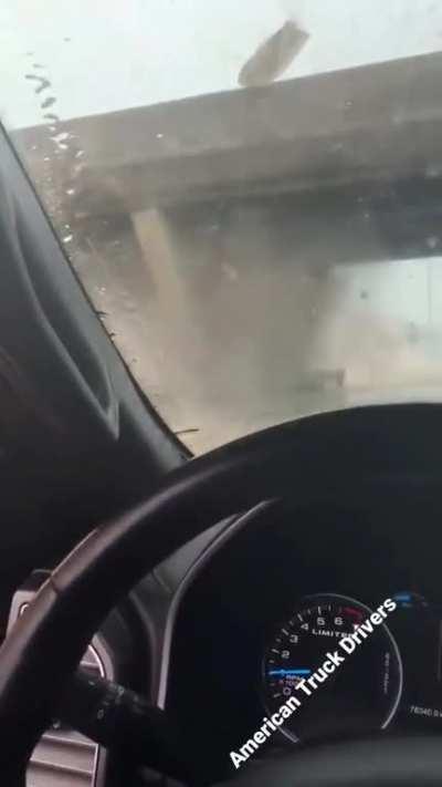 The moment a raised truck bed slams into an overpass