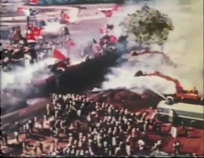 Japanese farmers battle with riot police to prevent the construction of a new airport on their land.