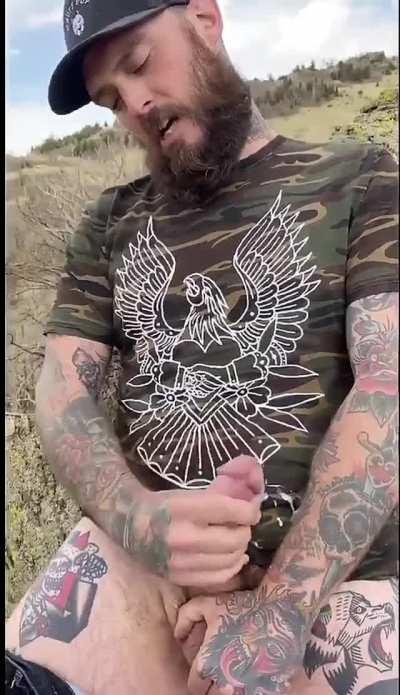 Tatted stud pulls out his cock and makes a huge mess in the great wide open