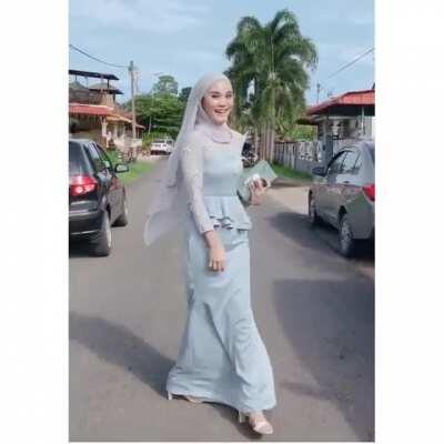 Pretty hijabi in a modern traditional dress.