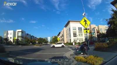 Driver narrowly misses child on scooter