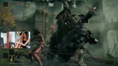 Harpist beats Margit with a literal harp (not harp bow)