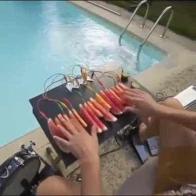 Man playing watermelon piano, yes its possible.