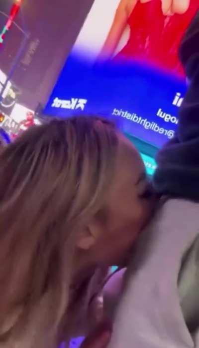 Kazumi in front of her billboard