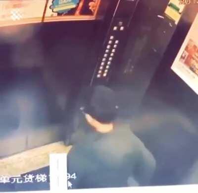 Man pisses on an elevator control panel. Not like there's anything important in there