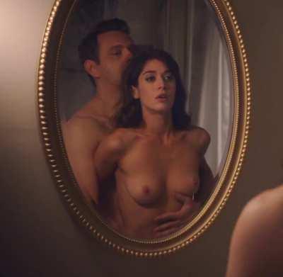 Watching herself in the mirror