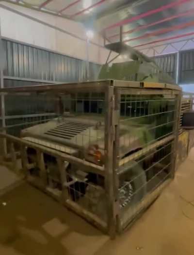 Ukrainian HMMWV armored vehicle retrofitted with cage to protect against FPV drones