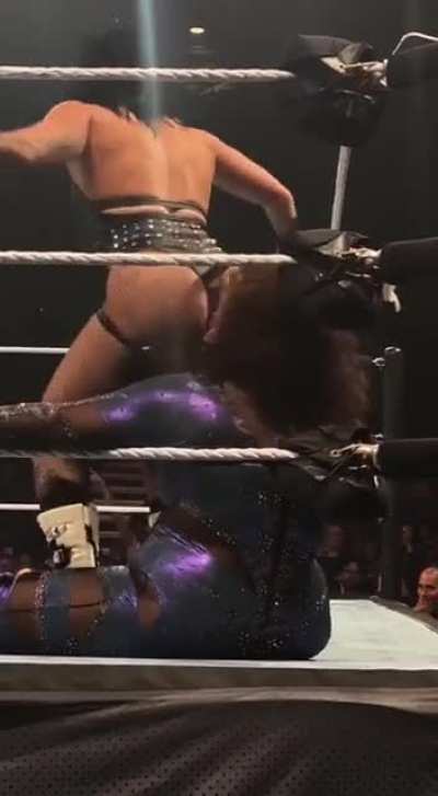Rhea Ripley hitting Nix Jax with a stinkface