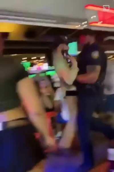 A grown ass man was picked up like a child and taken away