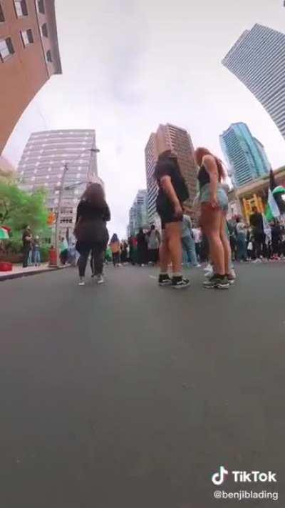 Viral rollerblader runs across a peaceful protest while he is outside