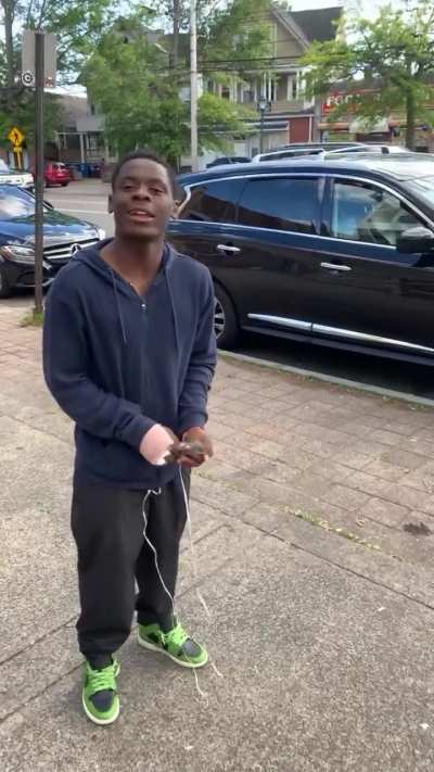 Some guy keeping a bird on a leash