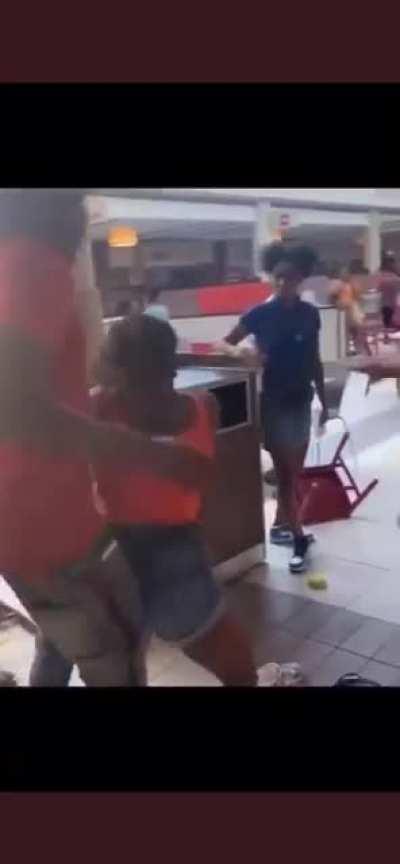 Fight in shopping mall food court