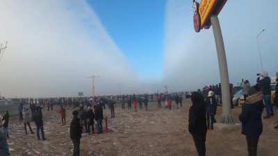 A plane parting the fog on approach