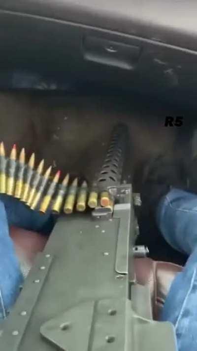 Carteles unidos sicarios patrolling in Michoacán, arms include a browning machine gun with tracer rounds in a 4 to 1 configuration