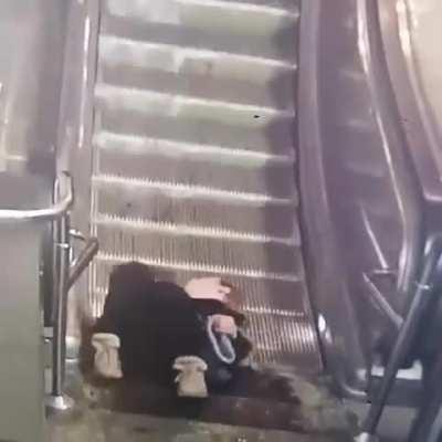 Sitting on a escalator